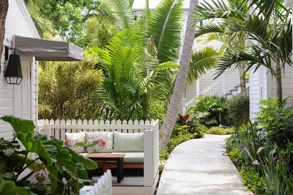 Sink into the tucked-away bench and breathe tropical air.