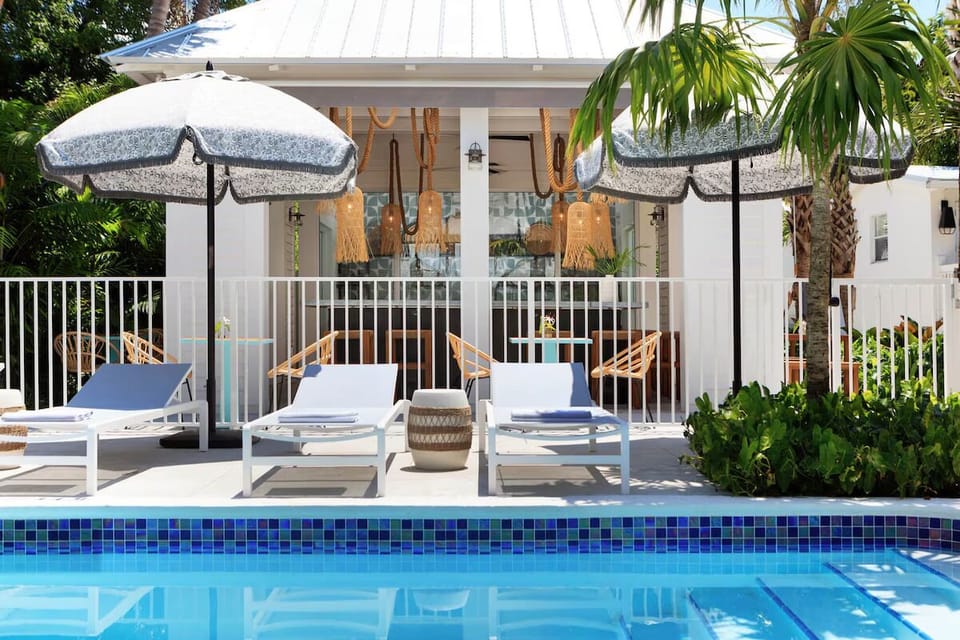 Relax with pool views while the bar buzzes nearby.