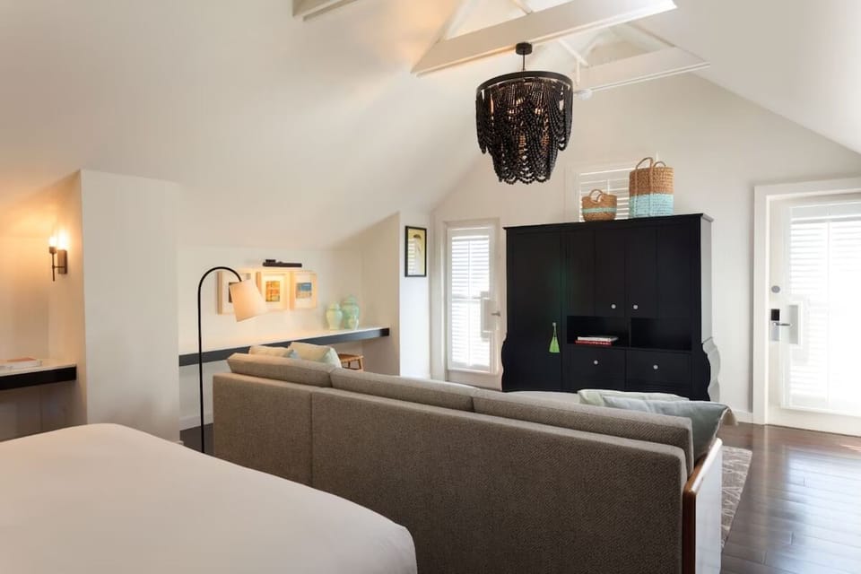 Relax after exploring with a sofa and breezy vaulted ceilings.