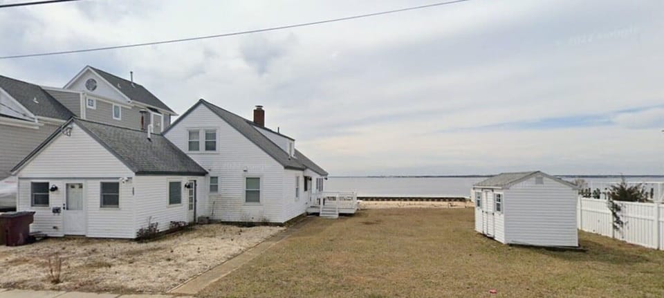 Exterior view.   Small deck for sunset watching and large yard for games