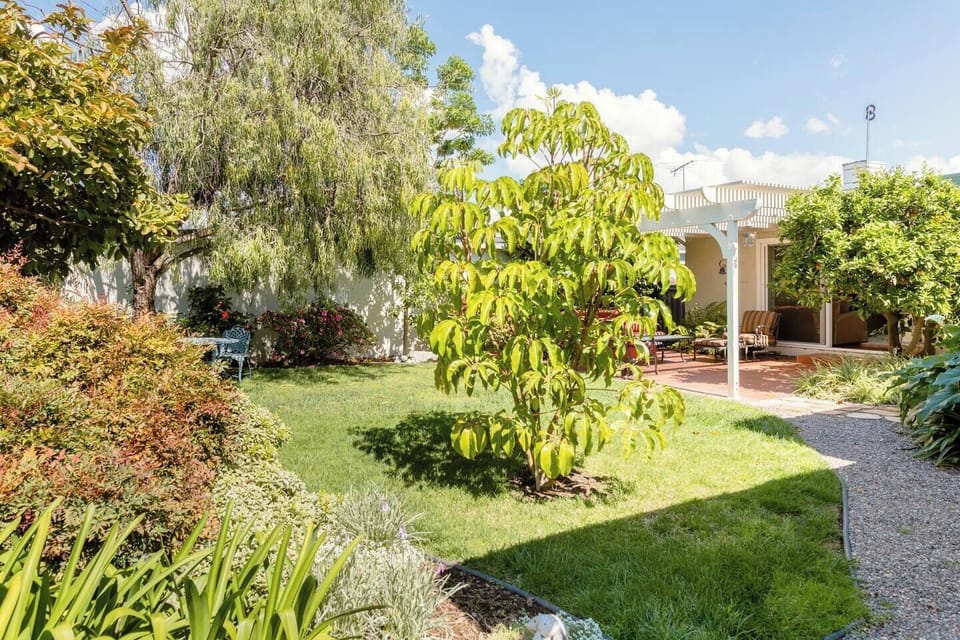 The backyard is an incredibly beautiful space, fully landscaped with flowers, fruit trees (help yourself), a seating area and a BBQ for your enjoyment while staying in our home.