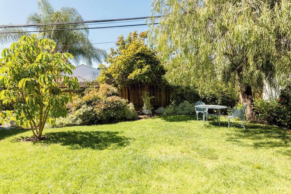 The backyard is an incredibly beautiful space, fully landscaped with flowers, fruit trees (help yourself), a seating area and a BBQ for your enjoyment while staying in our home.