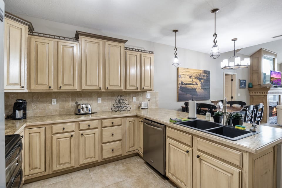 Beautifully designed kitchen with abundant cabinetry and a spacious layout perfect for preparing and enjoying meals together.