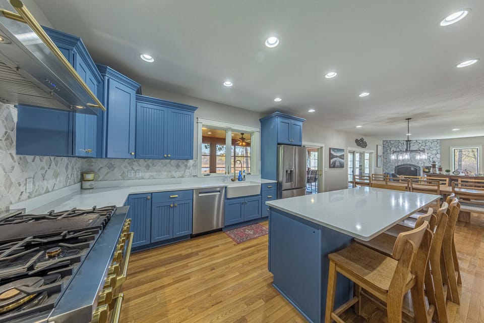 Custom kitchen with Z line gourmet gas stove with double oven