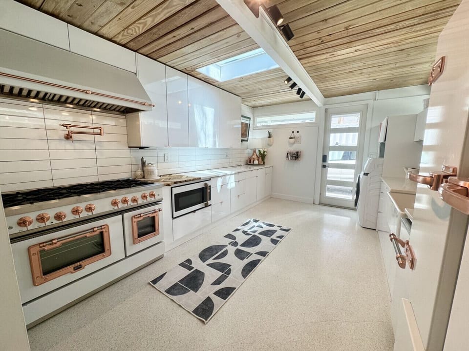 Kitchen with double oven, griddle & 6 burner gas range