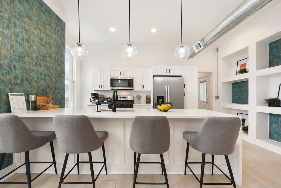 Stylish island seating—perfect for breakfasts, cocktails, and gathering