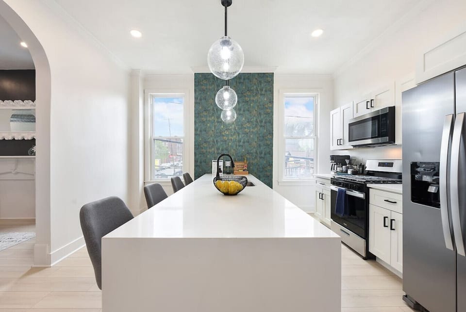 Modern chef’s kitchen with island seating and premium appliances