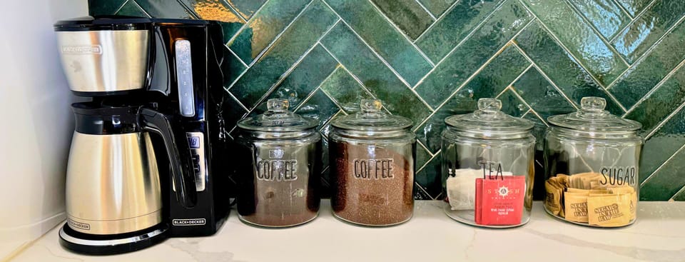 Wake up to the aroma of your favorite brew at our cozy tea and coffee station—fully equipped for your morning ritual.