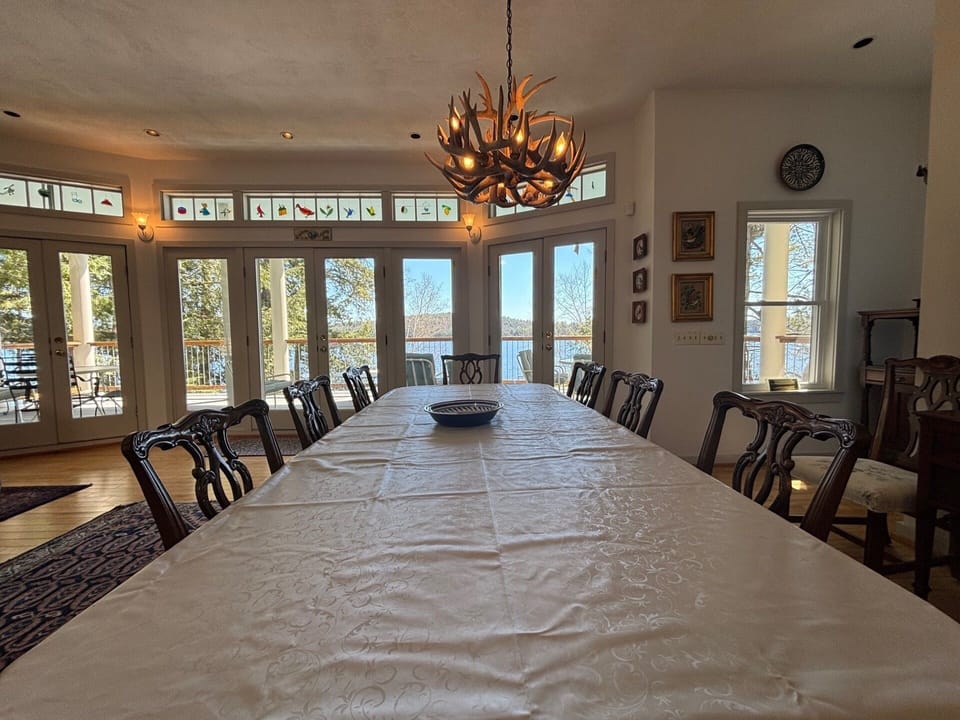 The Dining table has a antler chandelier