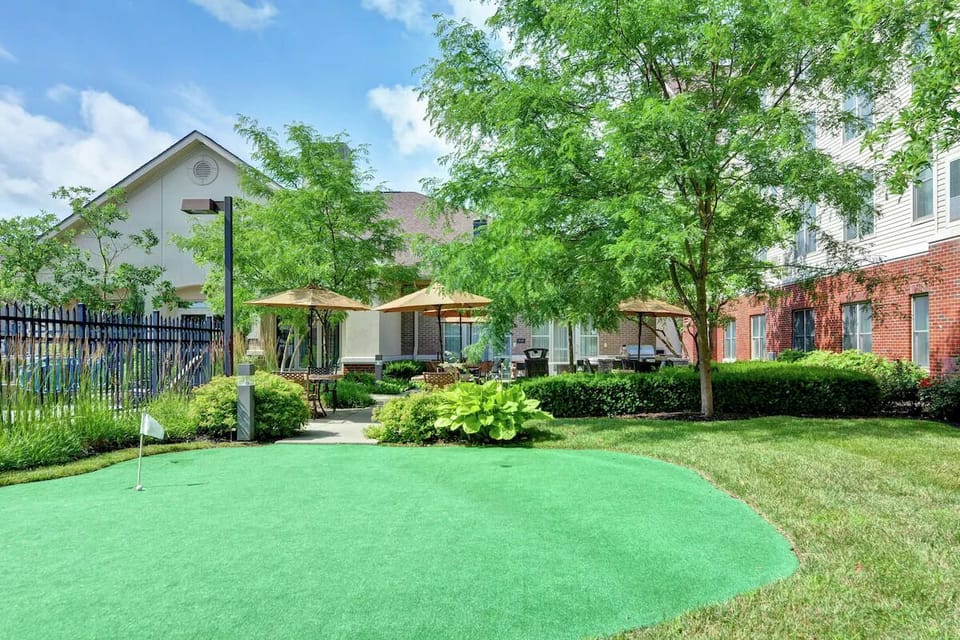 Play a quick round on the green in the sunny courtyard.
