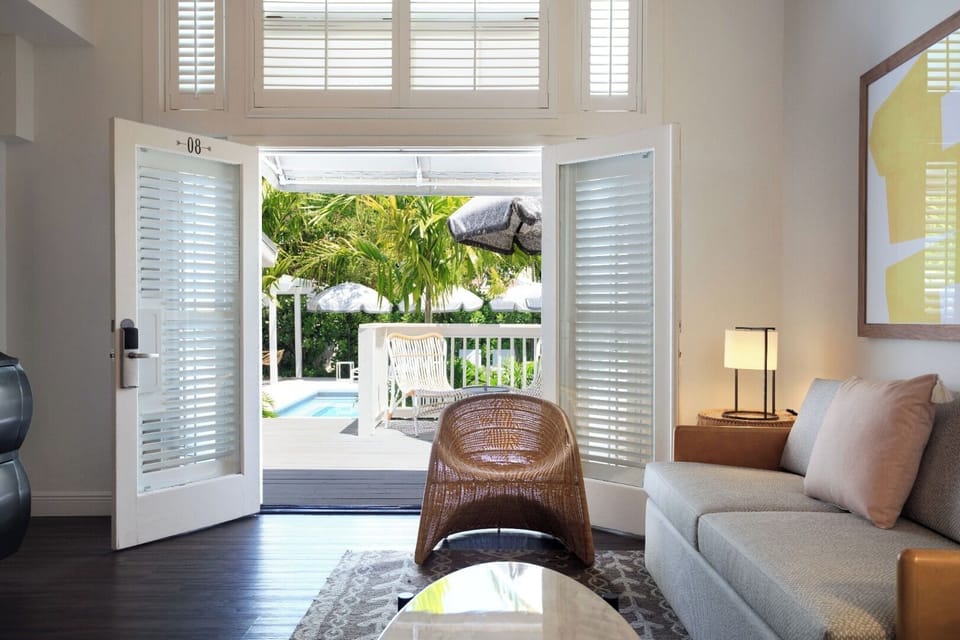 Step through French doors to sunshine and poolside lounging.