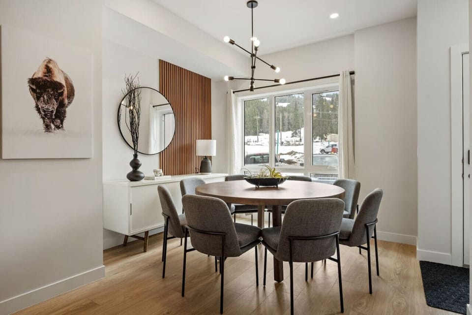 Dining area with seating for 8 and 4 more on the island.