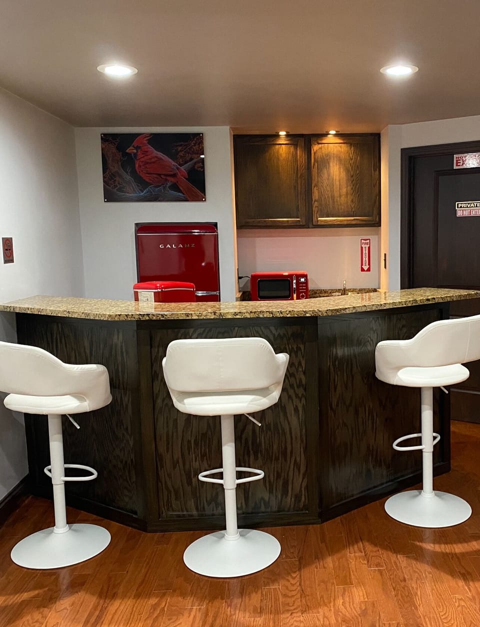 Wet bar area with retro refrigerator, ice maker and microwave