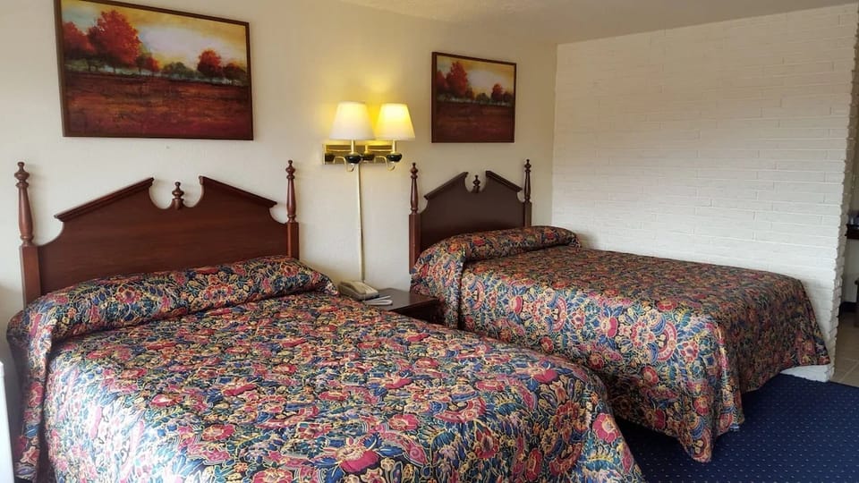 Sleep soundly in a classic room with two double beds.