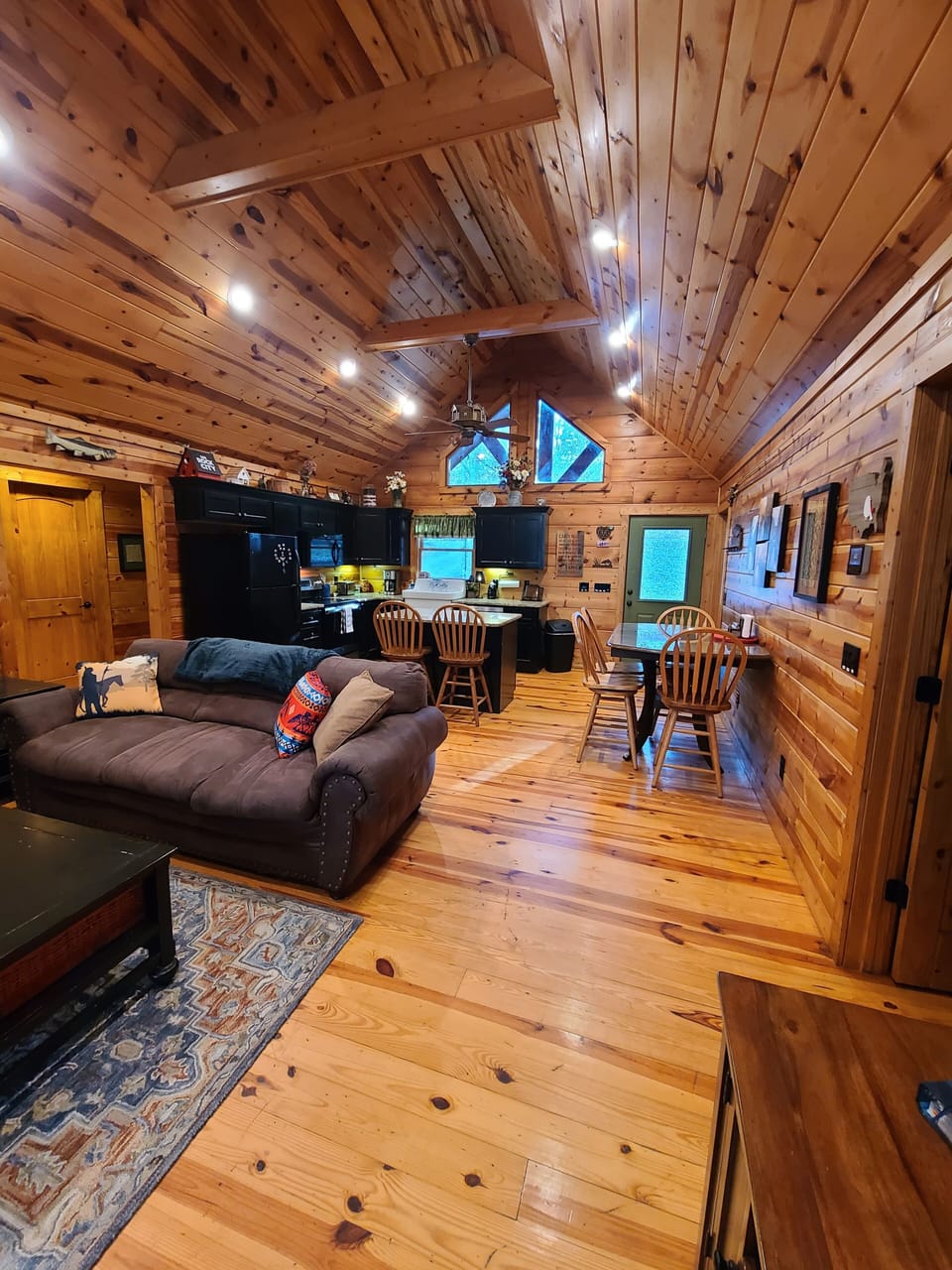 Livingroom, Dining Area and Kitchen, facing the front of the Cabin.