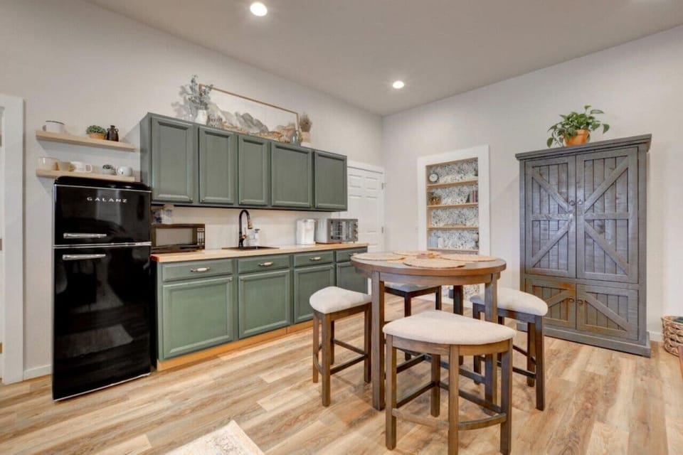Spacious great room Kitchenette, dining/game table, armoire storage and board games!!