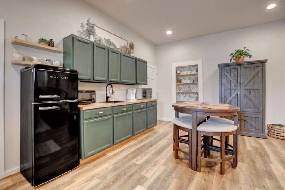Spacious great room Kitchenette, dining/game table, armoire storage and board games!!