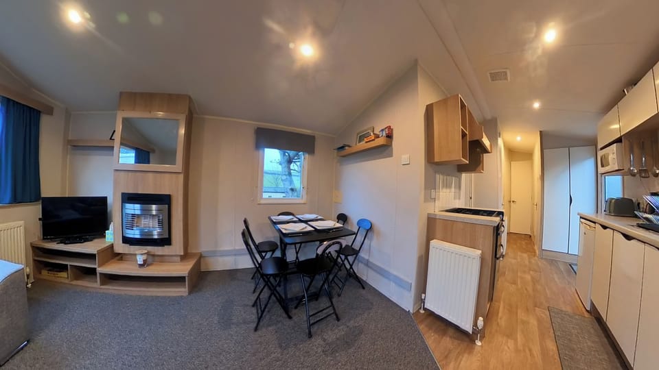 Dinning space with 6 seats - can fold away allowing more space within living room area for flexibility. 