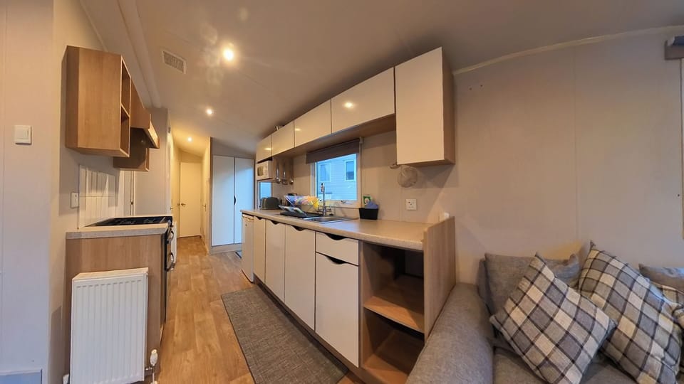 Kitchen area - fully equipped with kettle, toaster, fridge with small freezer compartment.  