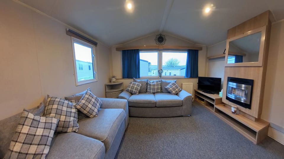 Living room has two large sofas, fireplace and TV with use of firestick. Internet is included within your stay free of charge