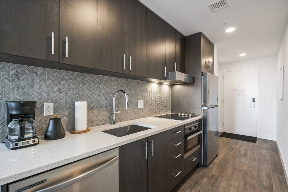 Full size kitchen with new appliances anbd coffee maker