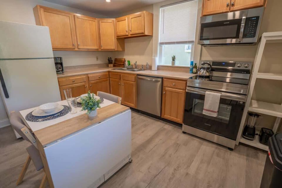 Kitchen with full appliances and cabinets