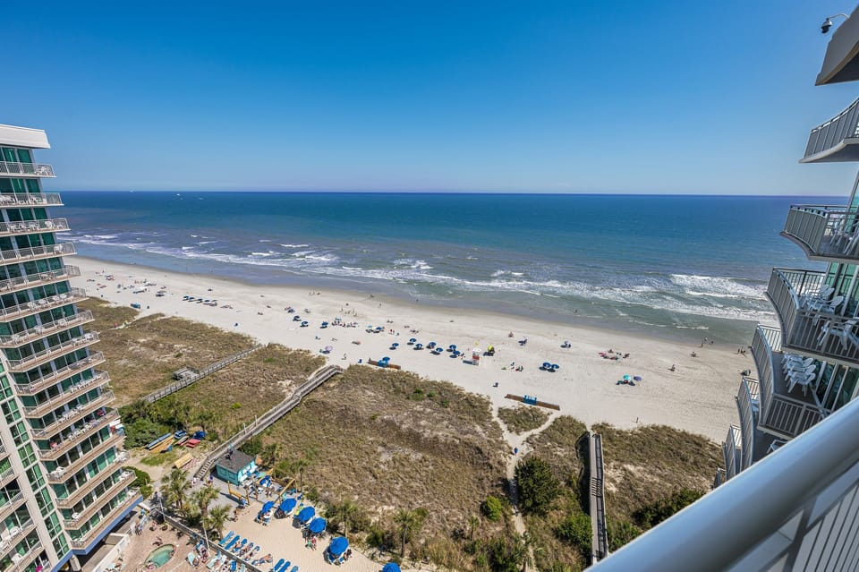 - Direct ocean view balcony from high floor condo for scenic stays   - Clear sightlines of waves shoreline and bright Myrtle Beach skies   - Outdoor retreat perfect for relaxing in your beach vacation rental