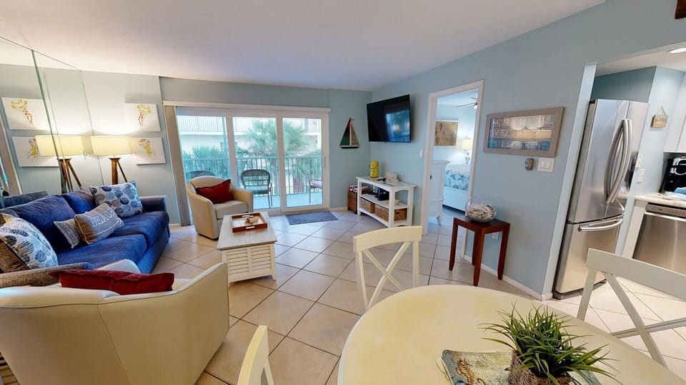 Family Room w/Dining Area and Large Flat Screen Tv. w/Private Balcony access.