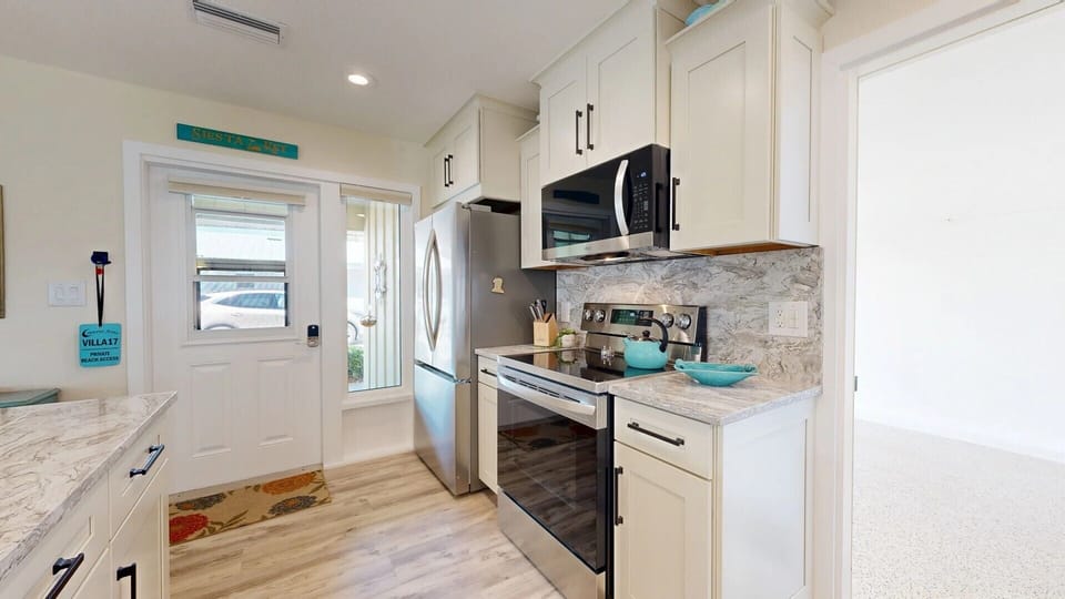 Stainless Steel Appliances.
Kitchen Door leading into garage