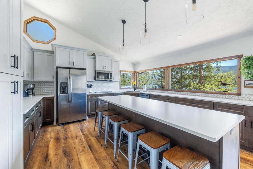 Spacious, fully stocked with island, bar seating, and ample storage (East Wing).