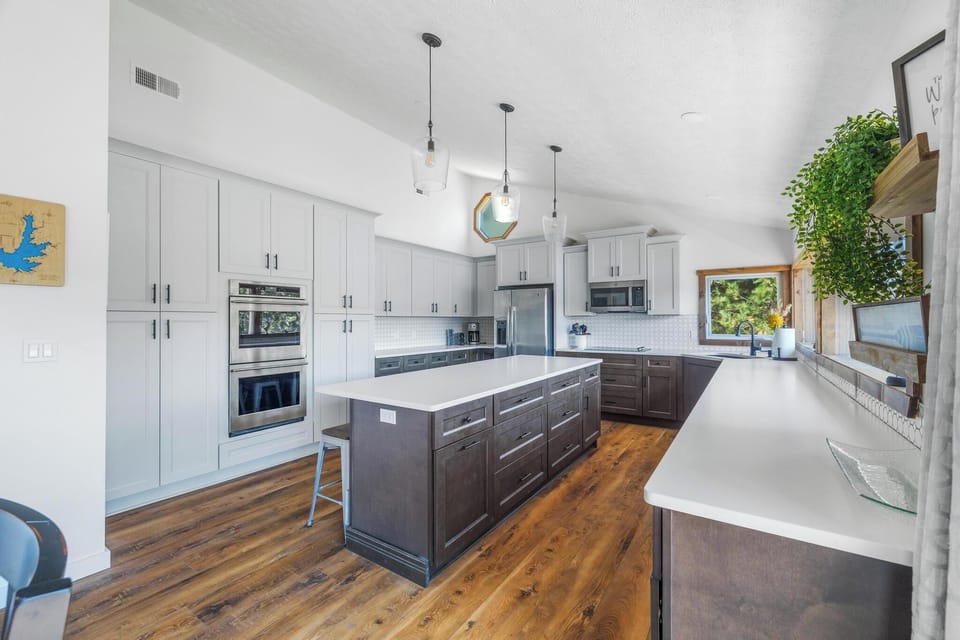 Spacious, fully stocked with island, bar seating, and ample storage (East Wing).