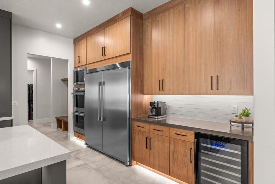 Fully stocked kitchen, wine fridge, full size fridge and freezer.  Coffee bar.