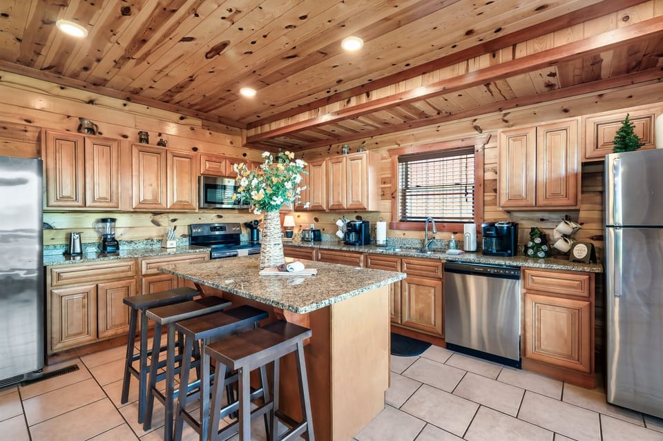 Kitchen w/ 2 fridges. Well stocked w/utensils,pots,pans for large group cooking