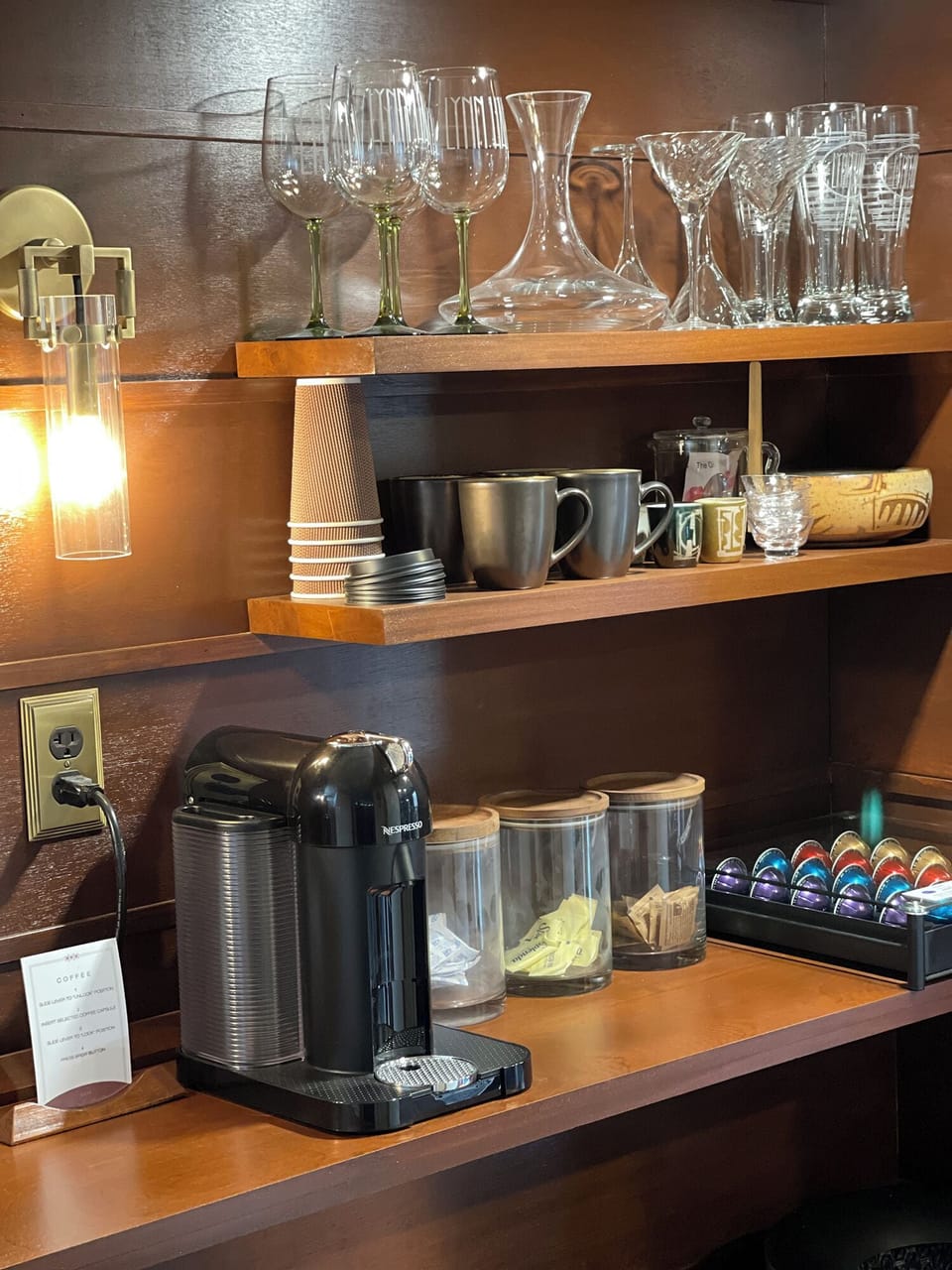 Morning coffee station with Nespresso coffee machine and coffee pods.