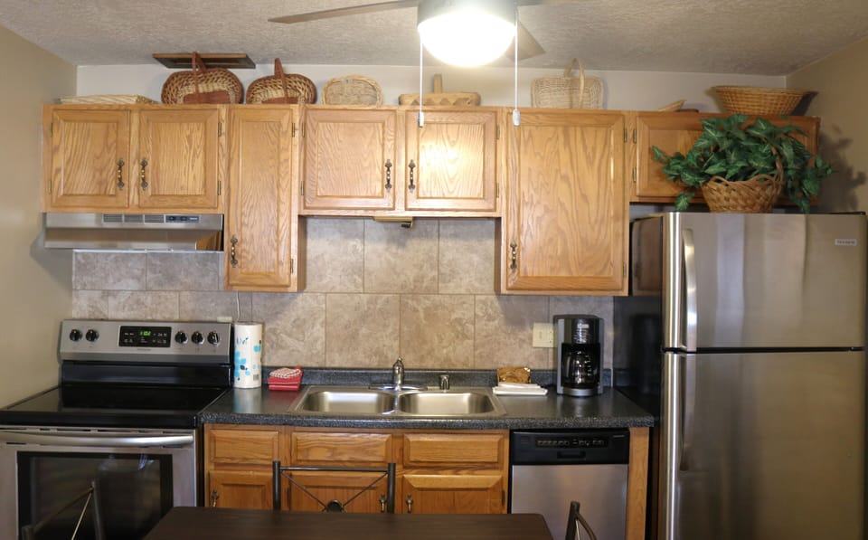 Fully equipped kitchen with stainless steel appliances and everything you need to whip up your favorite meals during your stay.