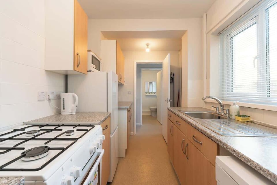 Enjoy cooking in this tidy kitchen space.
