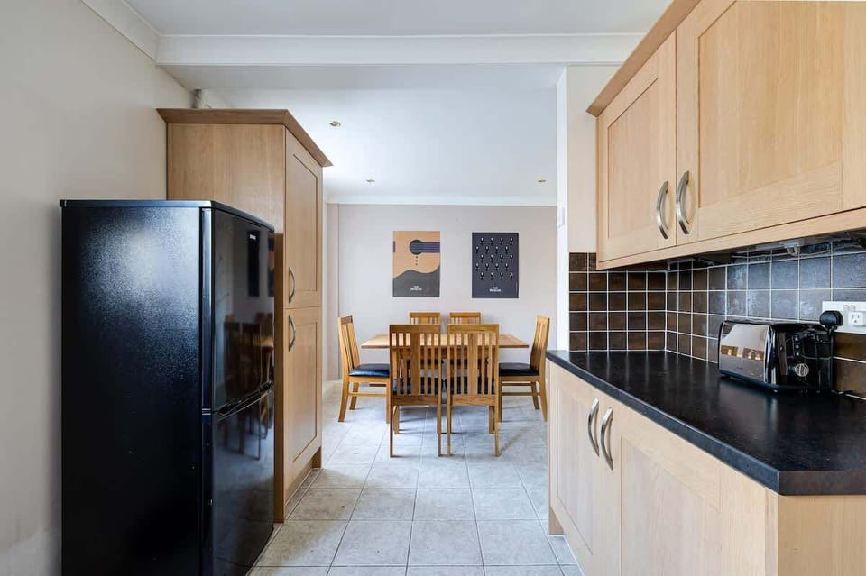 Kitchen area leading to the dining place