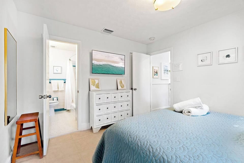 A peaceful night's sleep awaits you with a plush queen-size bed and blackout curtains