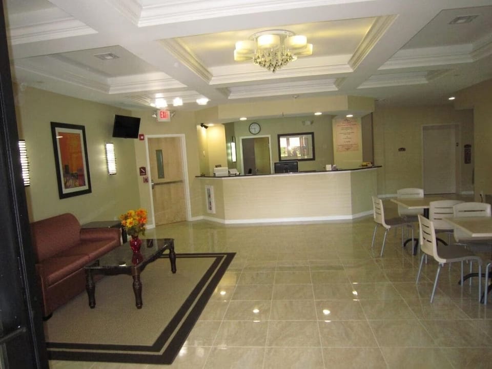 Check in smoothly at the spacious front desk under soft lighting.