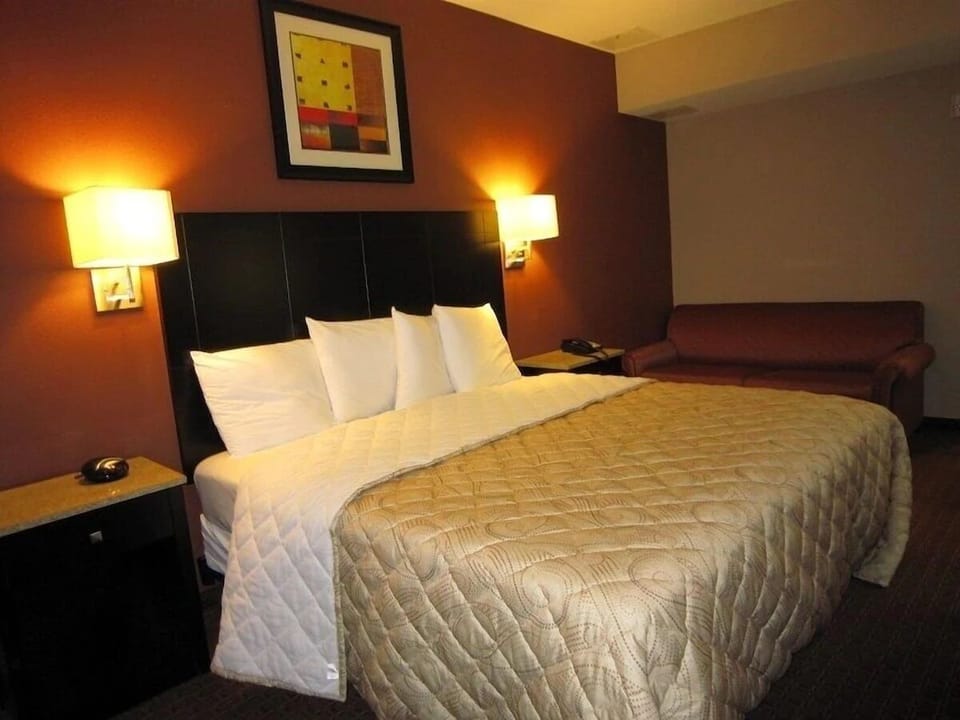 Relax into a serene bed setup with warm ambient glow.