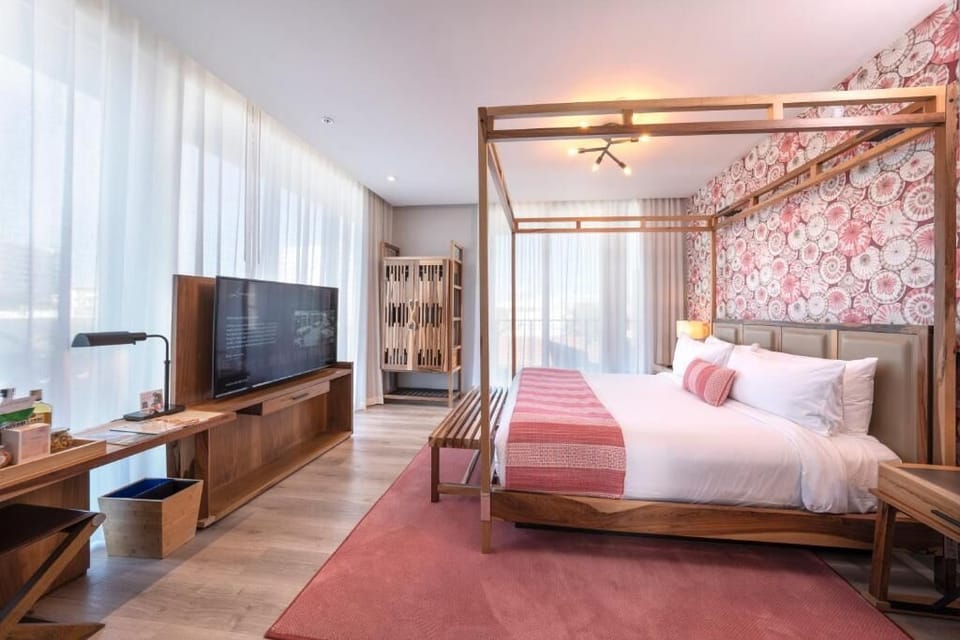 Recharge in a stylish suite with bold accent wall.