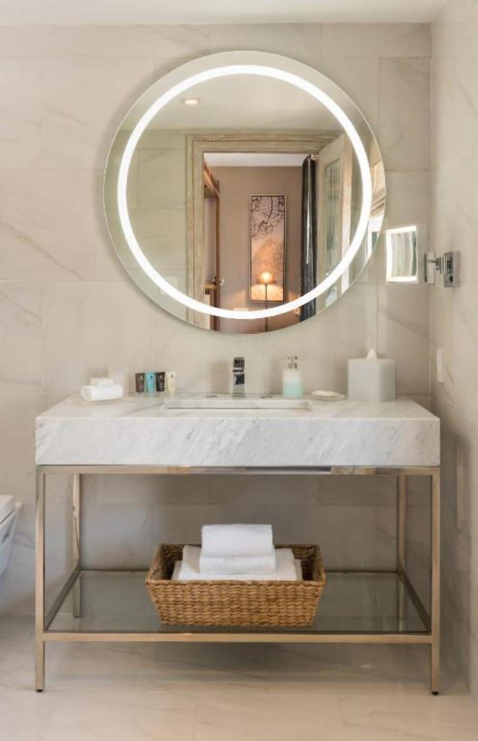 Refresh at a glowing mirror vanity with spa-smooth finishes.
