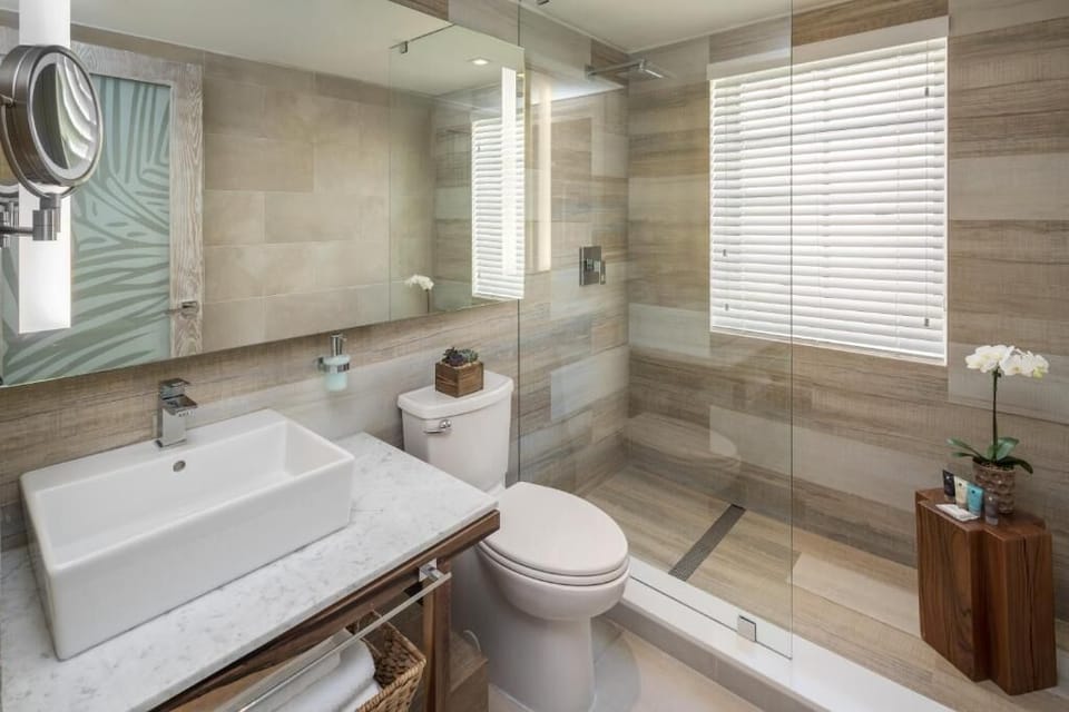 Rinse off in a spacious walk-in shower, clean and modern.