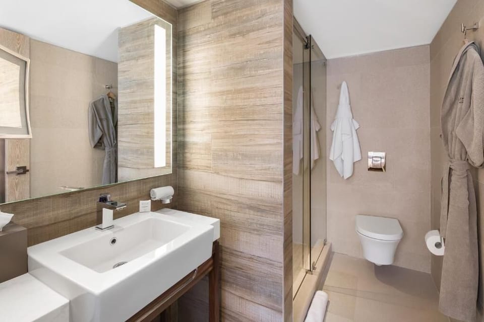 Enjoy a clean, modern bath with walk-in shower.