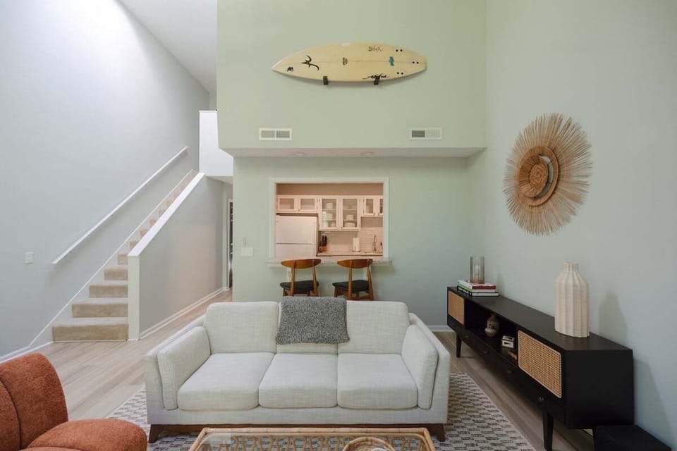 Relax in the coastal-inspired living area featuring airy décor and plenty of natural light.