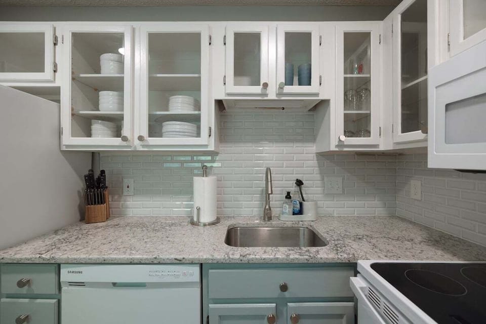 Cook like a local in this modern, fully equipped kitchen featuring a gas stove, stainless steel appliances, and all the essentials for dining in.