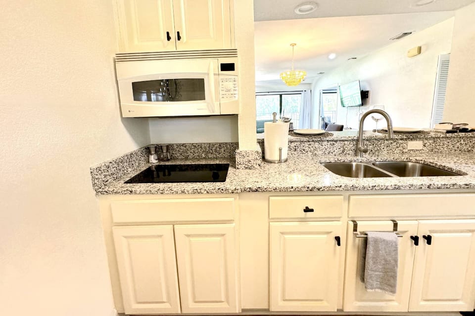 Kitchen with convection oven/microwave combination and two burner cook top!