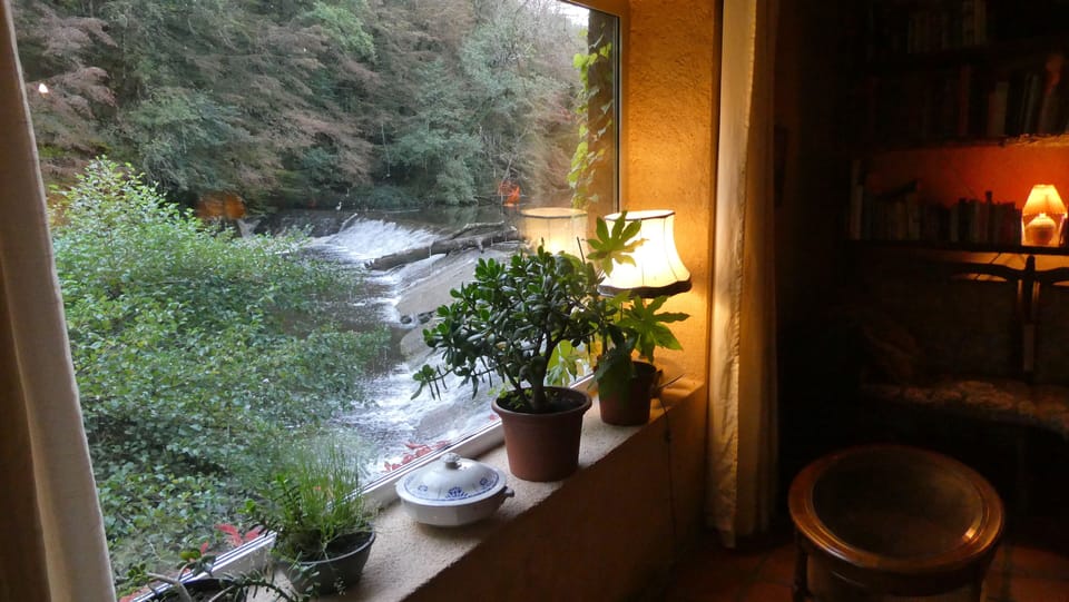 Living room, view over the weir.