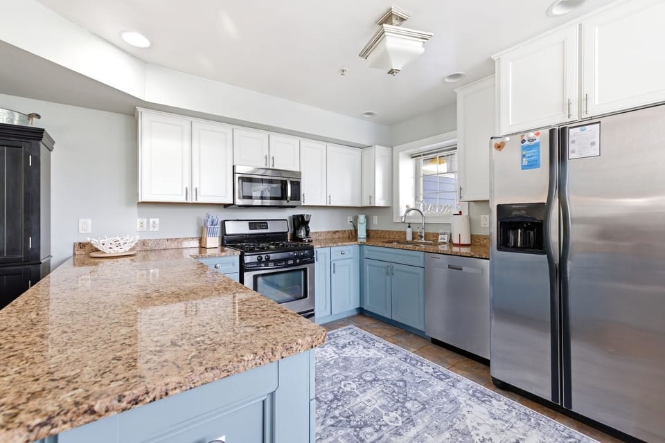 Spacious kitchen with ample counter space for preparing meals and snacks