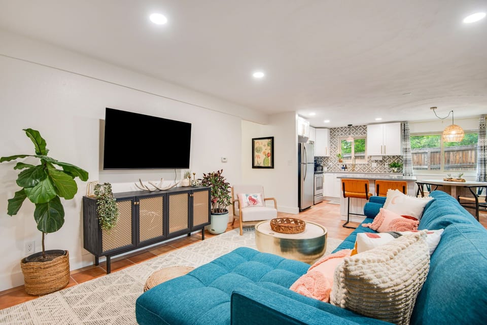 Fully furnished and expertly designed lounge space with large smart TV and lots of natural sunlight or room-darkening shades, to fit anyone's needs. The couch folds into a queen bed for two additional guests!